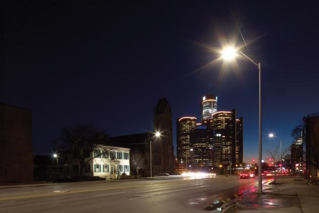 aluminum street lights on a nightime street